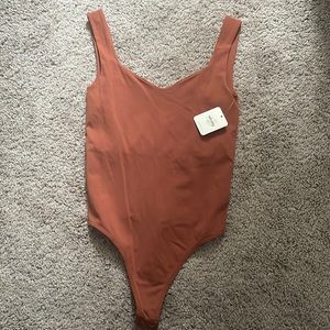 Brand new bodysuit in Terracotta from Free People